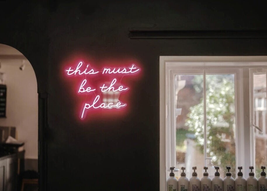 Neon sign reading 'this must be the place' at Jack & the Wolfe in Lymington, England, GB.