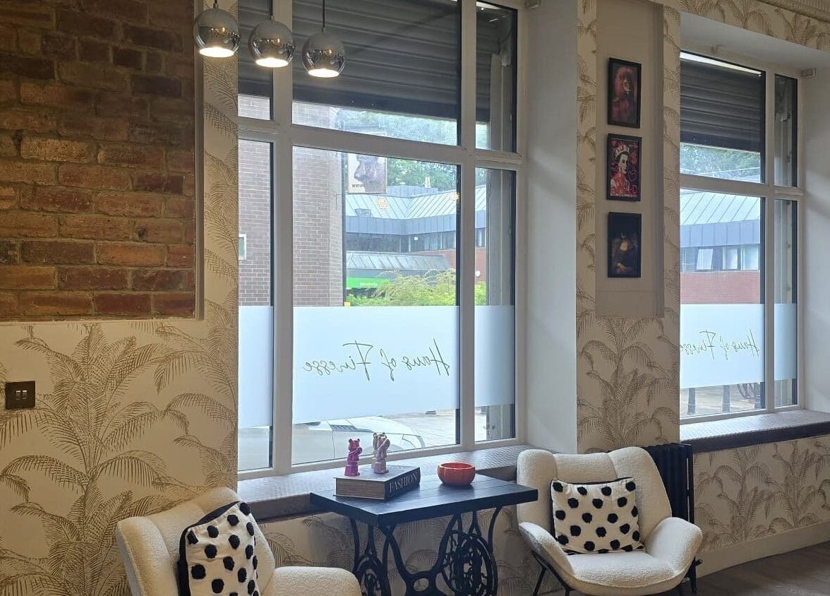 Cozy seating area at Freedom Beauty Co by Helen Isaacson, Houghton Le Spring, England, GB with stylish decor.