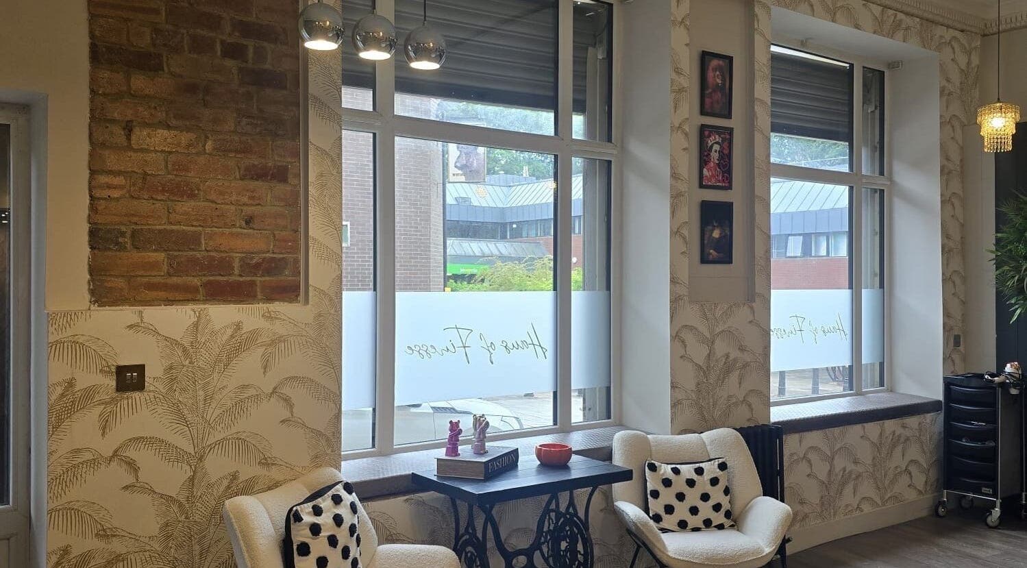 Cozy seating area at Freedom Beauty Co by Helen Isaacson, Houghton Le Spring, England, GB with stylish decor.