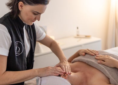 Facialist at Julie Devoisselle Facialiste giving a relaxing facial massage in Singapore, Singapore, SG.