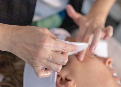 Expert facial massage by Julie Devoisselle Facialiste in Singapore, SG enhancing relaxation and skin rejuvenation.