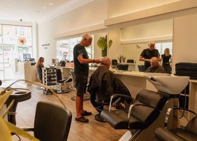 Professional hair stylist at David Masters Salon - St Margarets, Twickenham, England, GB, attending a client.