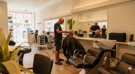 Professional hair stylist at David Masters Salon - St Margarets, Twickenham, England, GB, attending a client.
