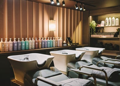 Luxurious salon wash area at Alchemy Berkhamsted, Berkhamsted, England, GB with stylish decor and premium hair products.