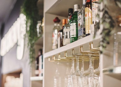 Elegant shelf display of spirits at Alchemy Berkhamsted, Berkhamsted, England, GB.