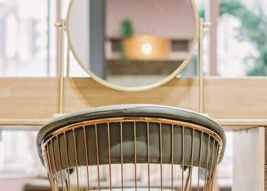 Elegant salon chair and mirror at Alchemy Berkhamsted, Berkhamsted, England, GB.