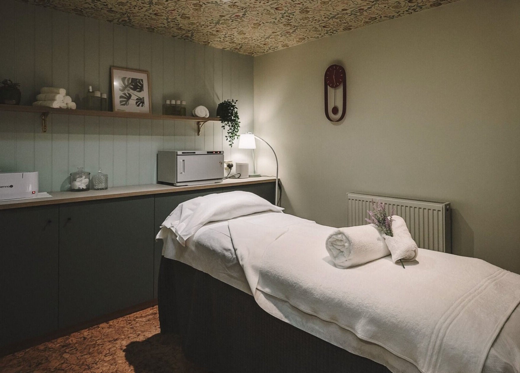 Massage room at Cecily Marlow in Marlow, England, GB featuring a cozy treatment bed and warm lighting.