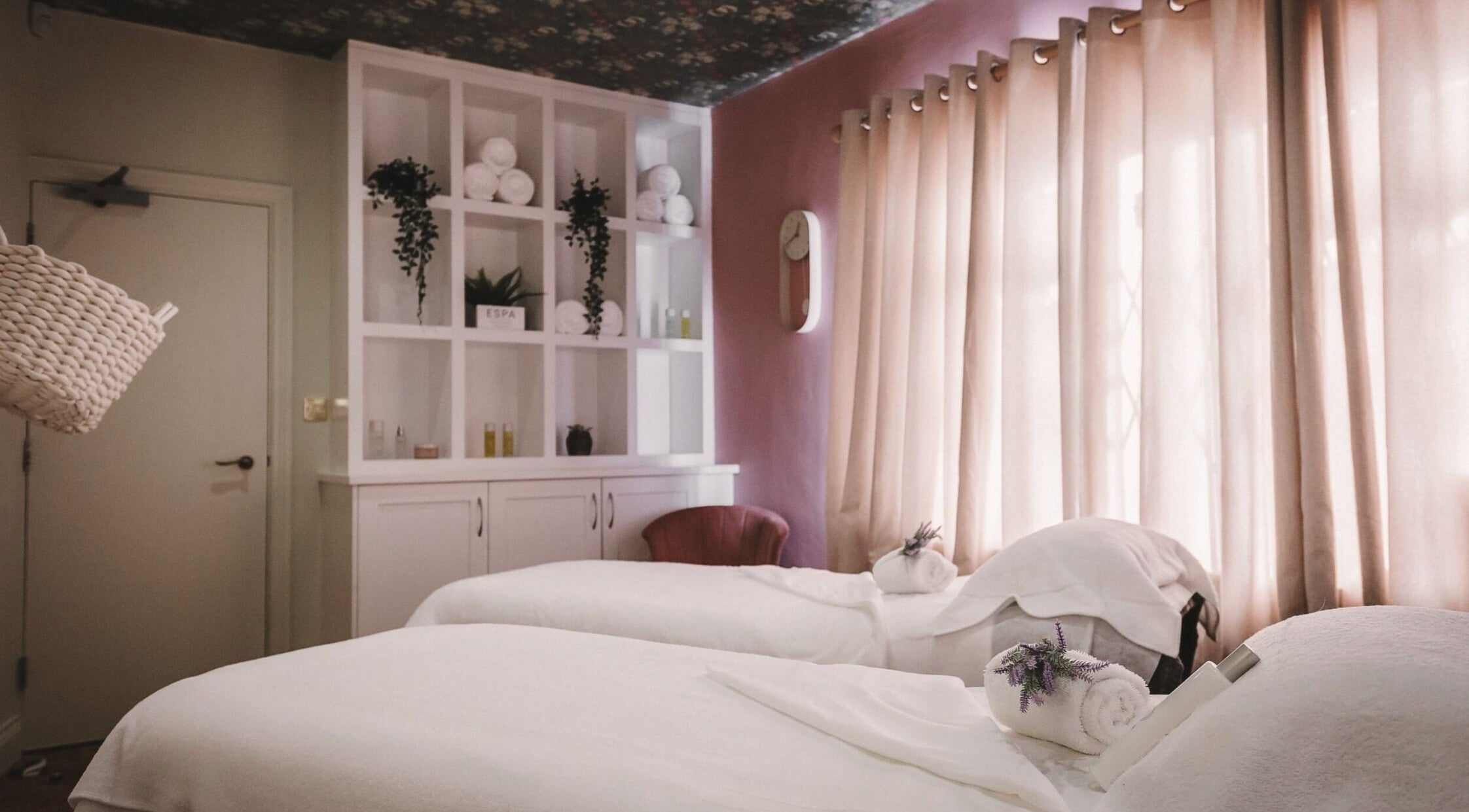 Cozy spa room at Cecily Marlow, Marlow, England, GB with two massage tables and soft lighting.