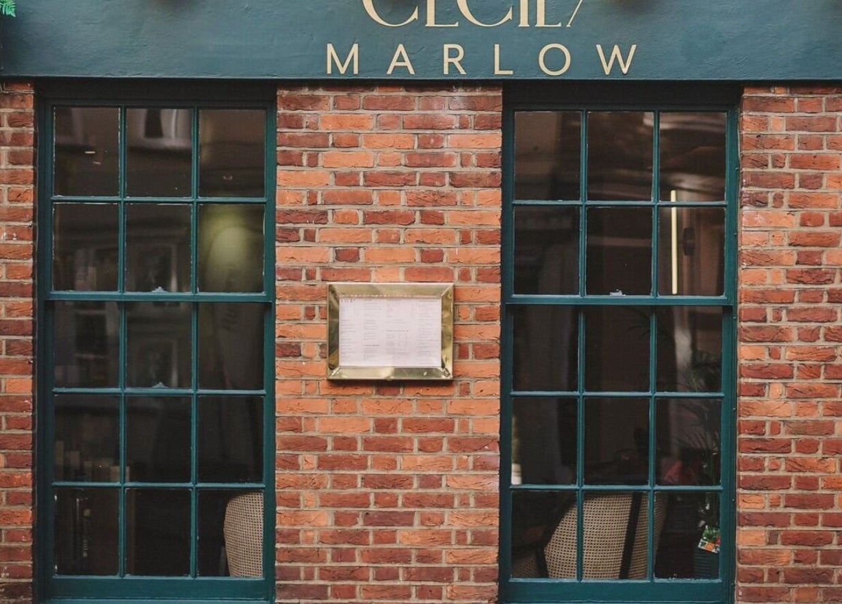 Cecily Marlow's elegant brick facade in Marlow, England, GB features classic windows and stylish signage.