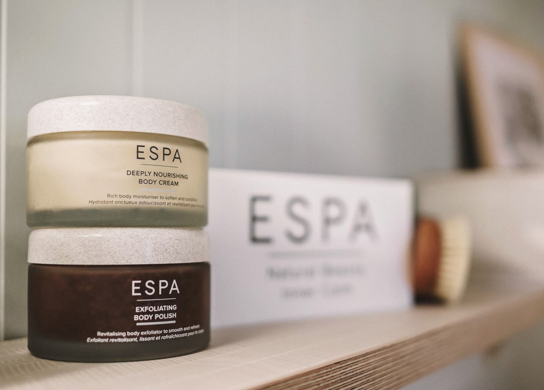 ESPA creams on a wooden shelf at Cecily Marlow, Marlow, England, GB. Enhance wellness with premium beauty products.