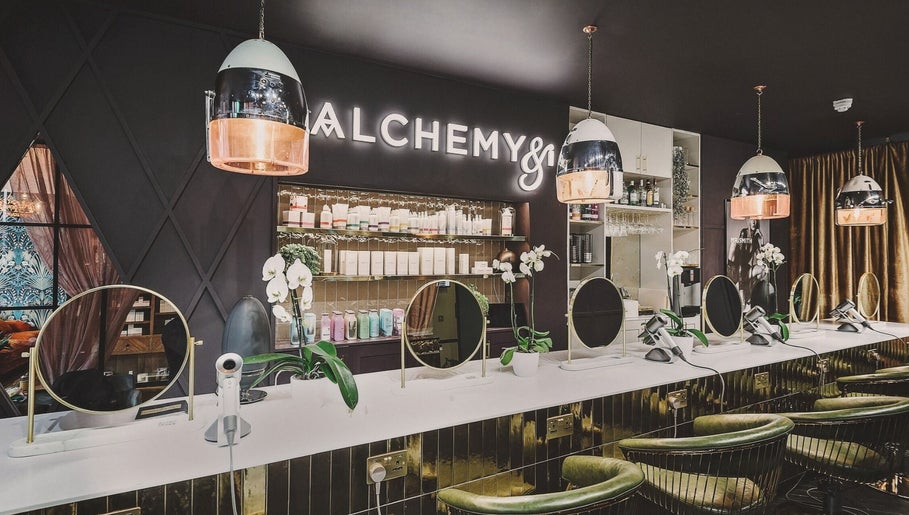 Modern beauty station at Alchemy & I, Berkhamsted, England, GB with elegant mirrors and stylish decor.
