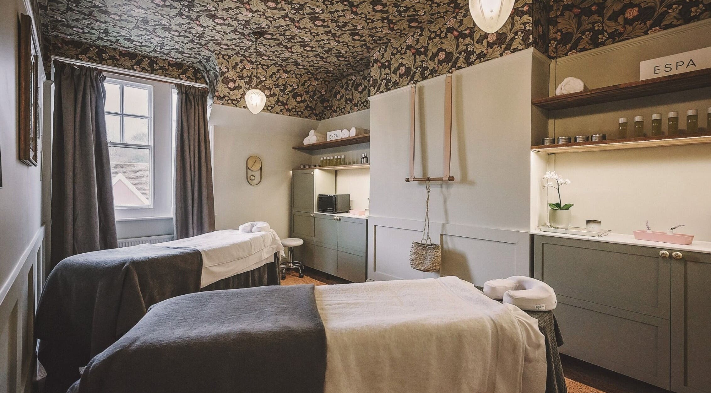 Relaxing treatment room at Cecily Spa Berkhamsted, England, GB with elegant decor and twin massage tables.