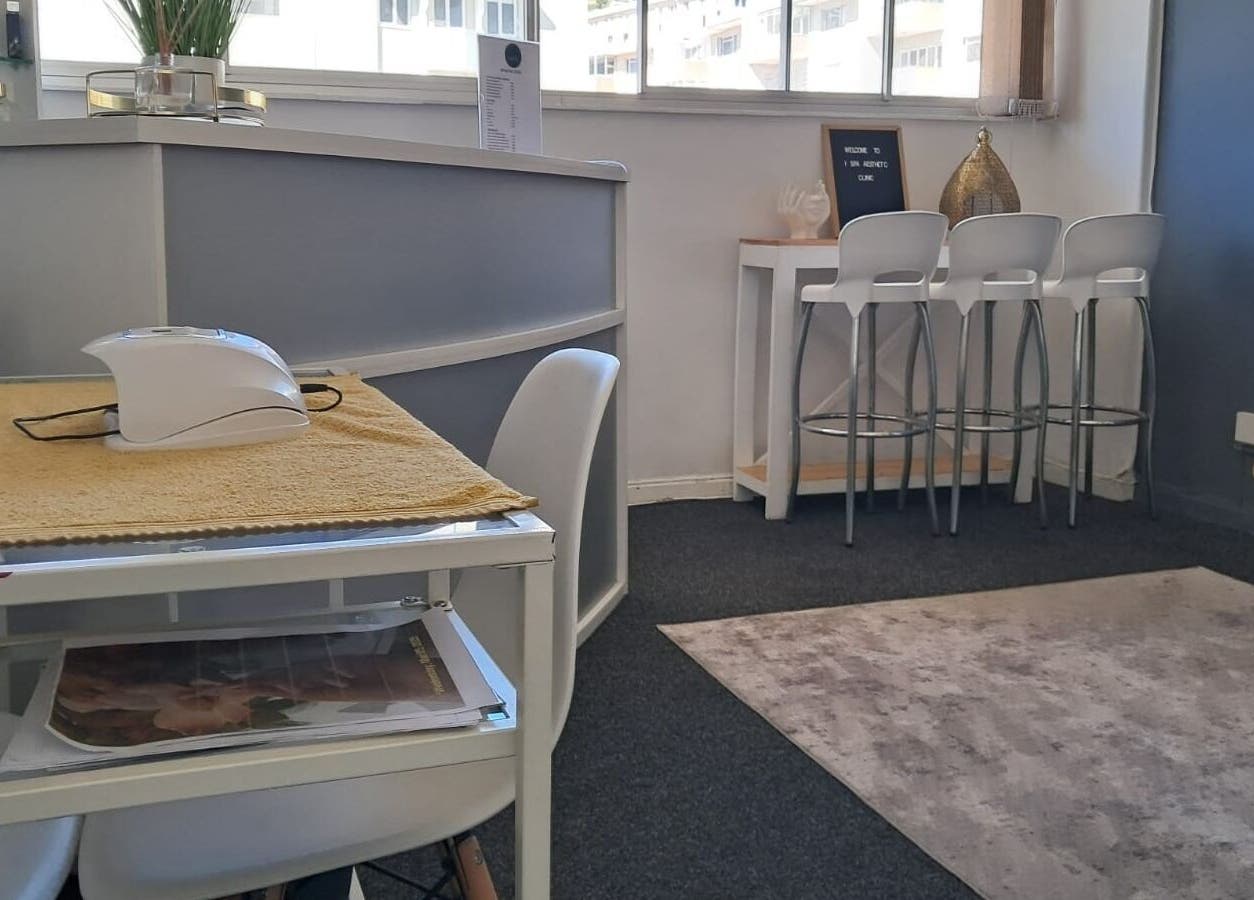 Modern, inviting reception at Ispa Aesthetics, Cape Town, Western Cape, ZA with sleek design and comfortable seating.