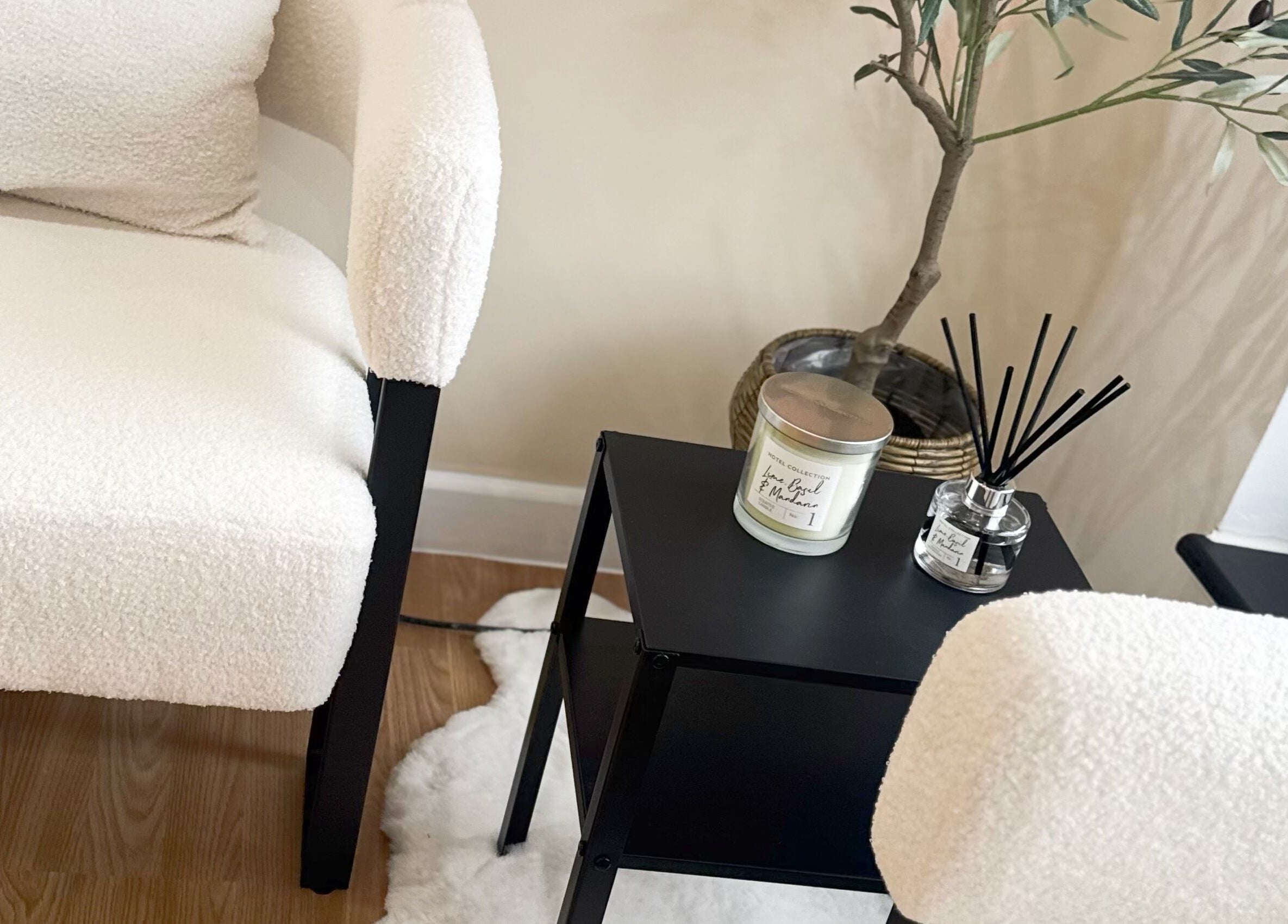 Cozy seating with white texture, scent candle, and plants at J9 Aesthetics, Harworth, England, GB.