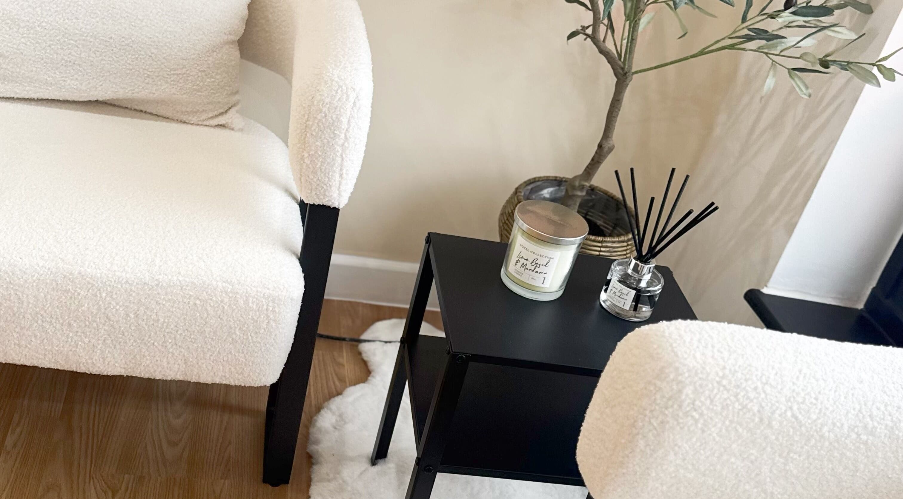 Cozy seating with white texture, scent candle, and plants at J9 Aesthetics, Harworth, England, GB.