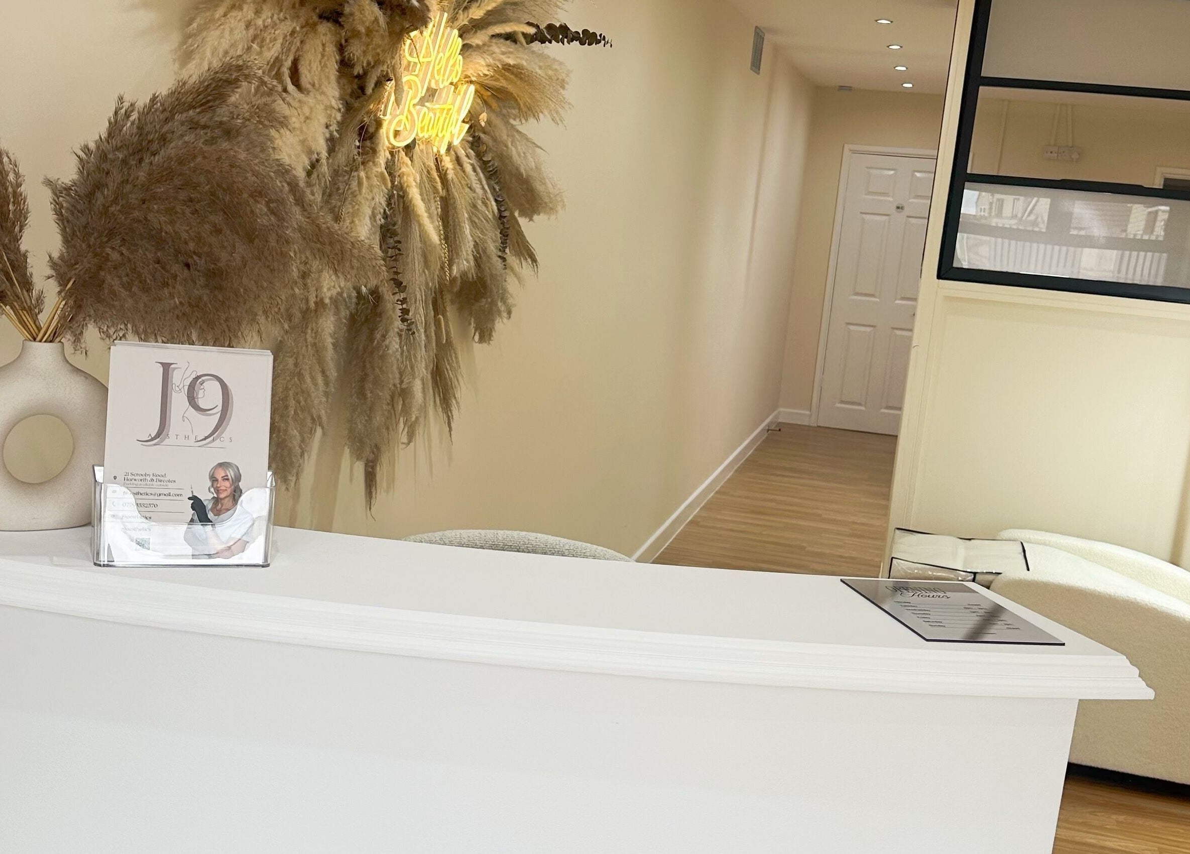 Reception of J9 Aesthetics in Harworth, England, GB, featuring elegant decor and soft lighting.
