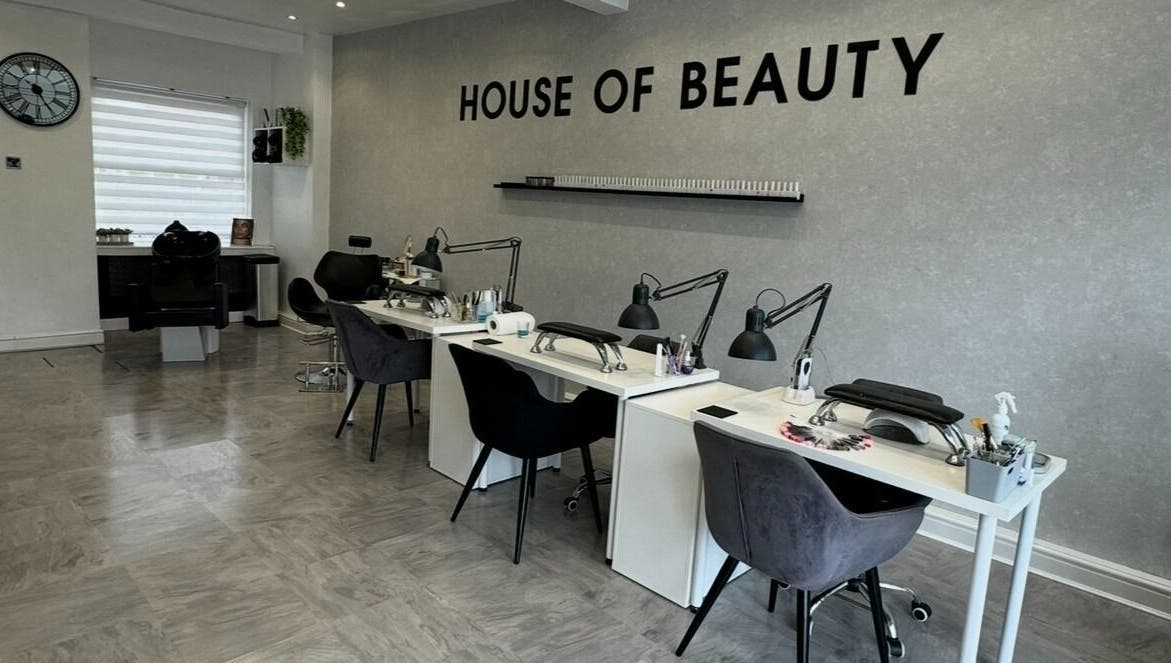 Interior of House Of Beauty in Failsworth, England, featuring elegant manicure stations.