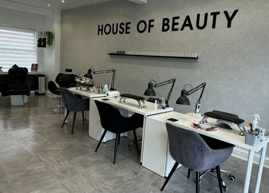 Interior of House Of Beauty in Failsworth, England, featuring elegant manicure stations.