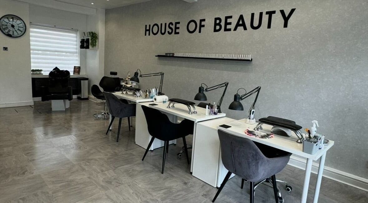 Interior of House Of Beauty in Failsworth, England, featuring elegant manicure stations.