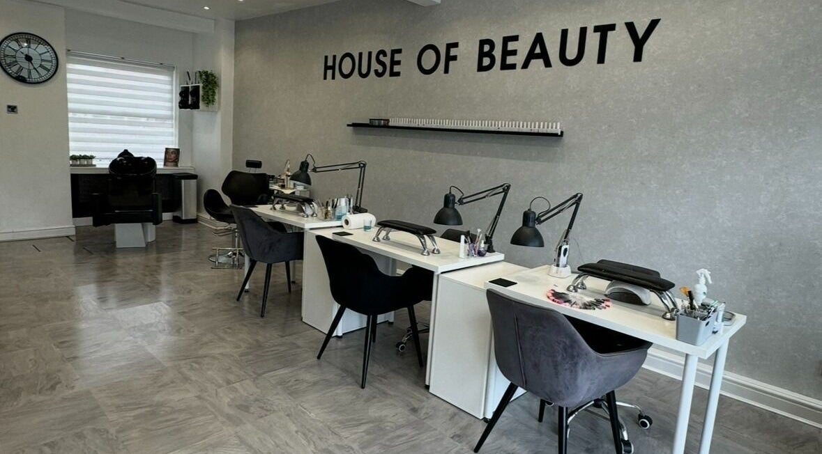 Interior of House Of Beauty in Failsworth, England, featuring elegant manicure stations.