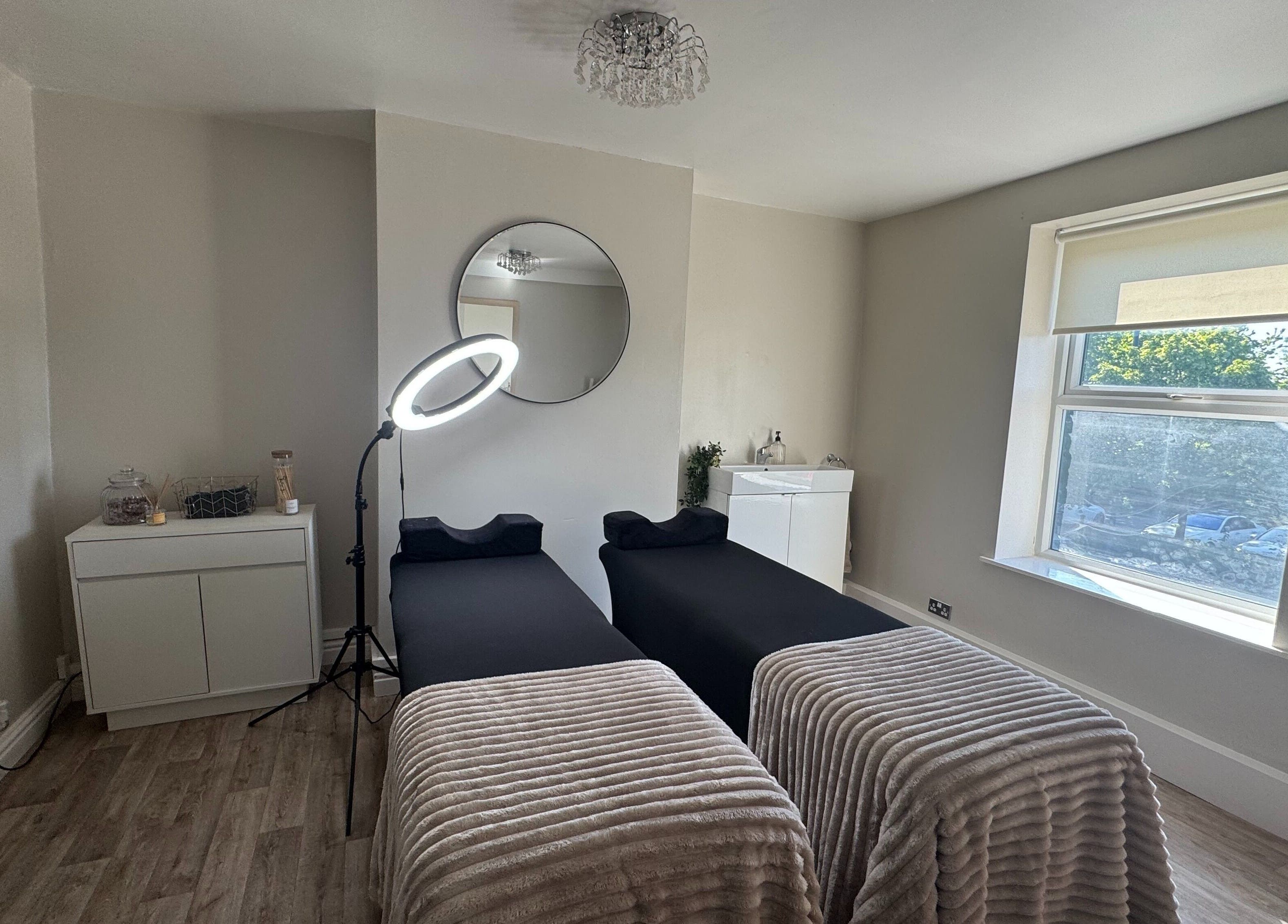 Peaceful treatment room at House Of Beauty, Failsworth, England, GB with cozy massage beds and soft lighting.