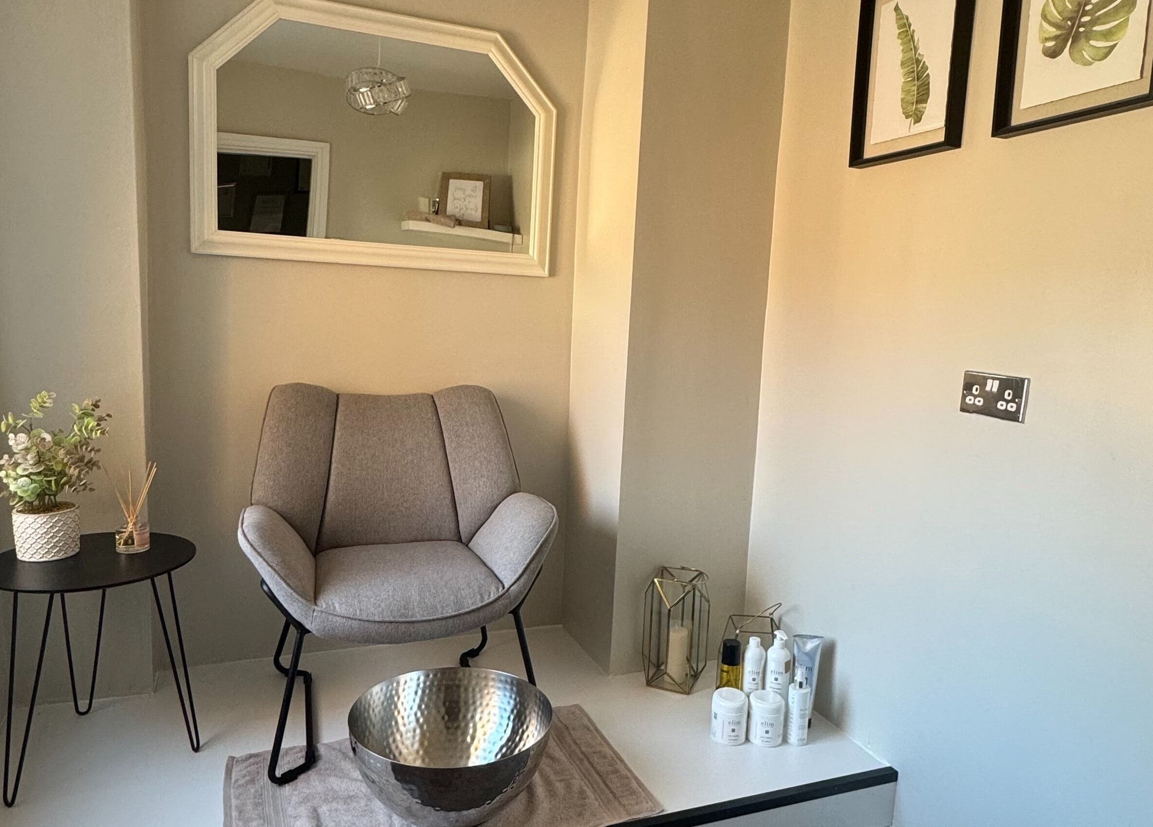 Elegant relaxation corner at House Of Beauty, Failsworth, England, GB with a plush chair and stylish decor.