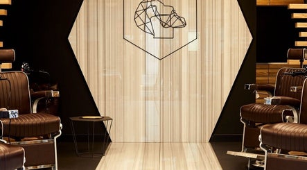 Stylish barber chairs at ADAM Grooming Atelier - Liverpool Street, London, England, GB.