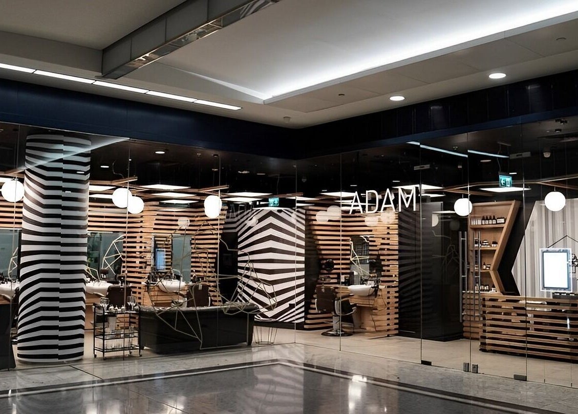 Stylish interior of ADAM Grooming Atelier - Monument, a premium barber in London, England, GB.