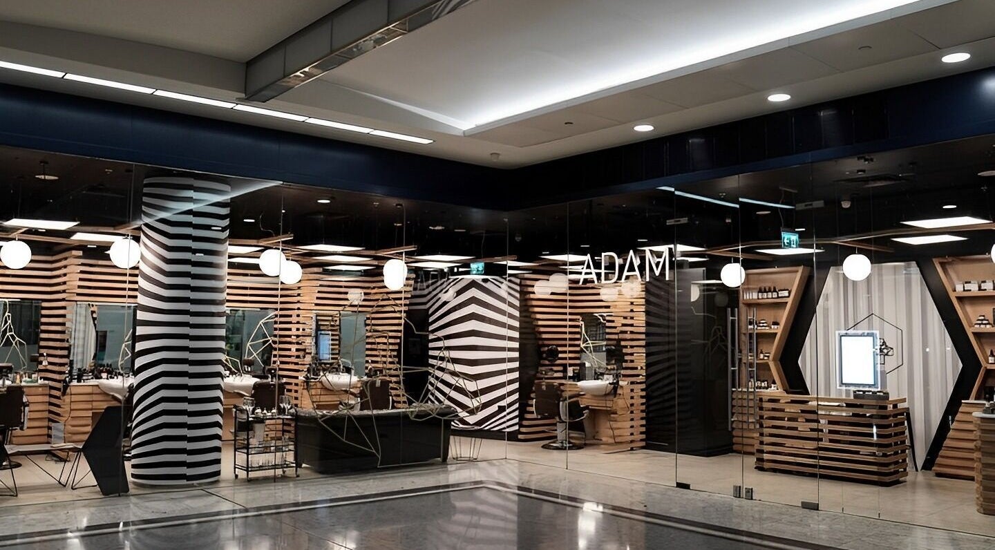 Stylish interior of ADAM Grooming Atelier - Monument, a premium barber in London, England, GB.