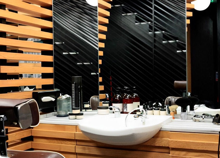 Sleek grooming station at ADAM Grooming Atelier - Monument, London, England, GB with modern design and tools.