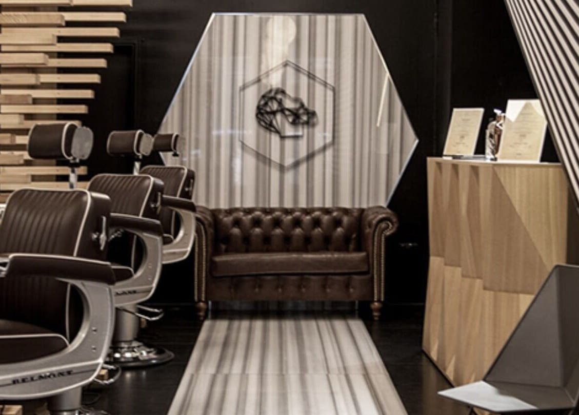 Luxurious barber chairs and lounge at ADAM Grooming Atelier - Monument, London, England, GB.