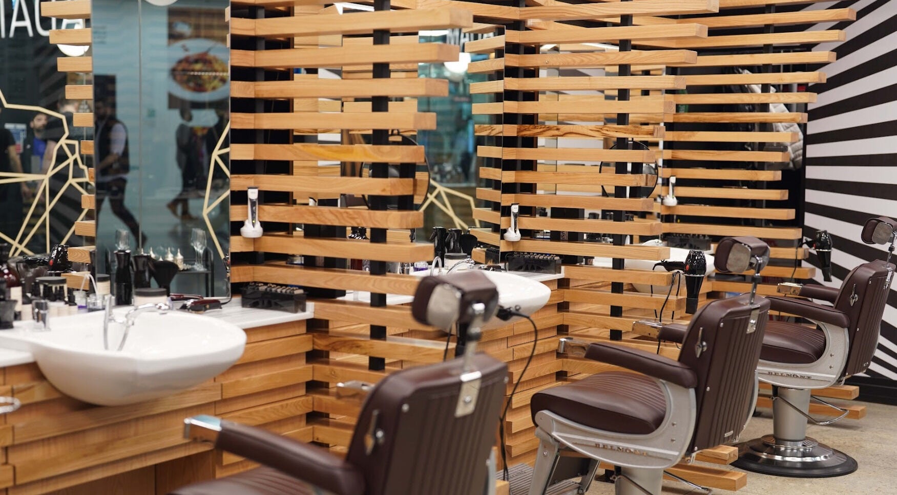 Stylish interior of ADAM Grooming Atelier - Canary Wharf Mall Jubilee Place, London, England, GB.