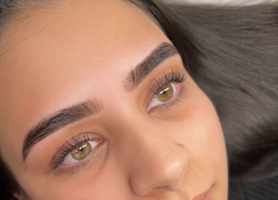Close-up of beautifully shaped eyebrows at Faces Enhanced, Nottingham, England, GB showcasing expert treatment.
