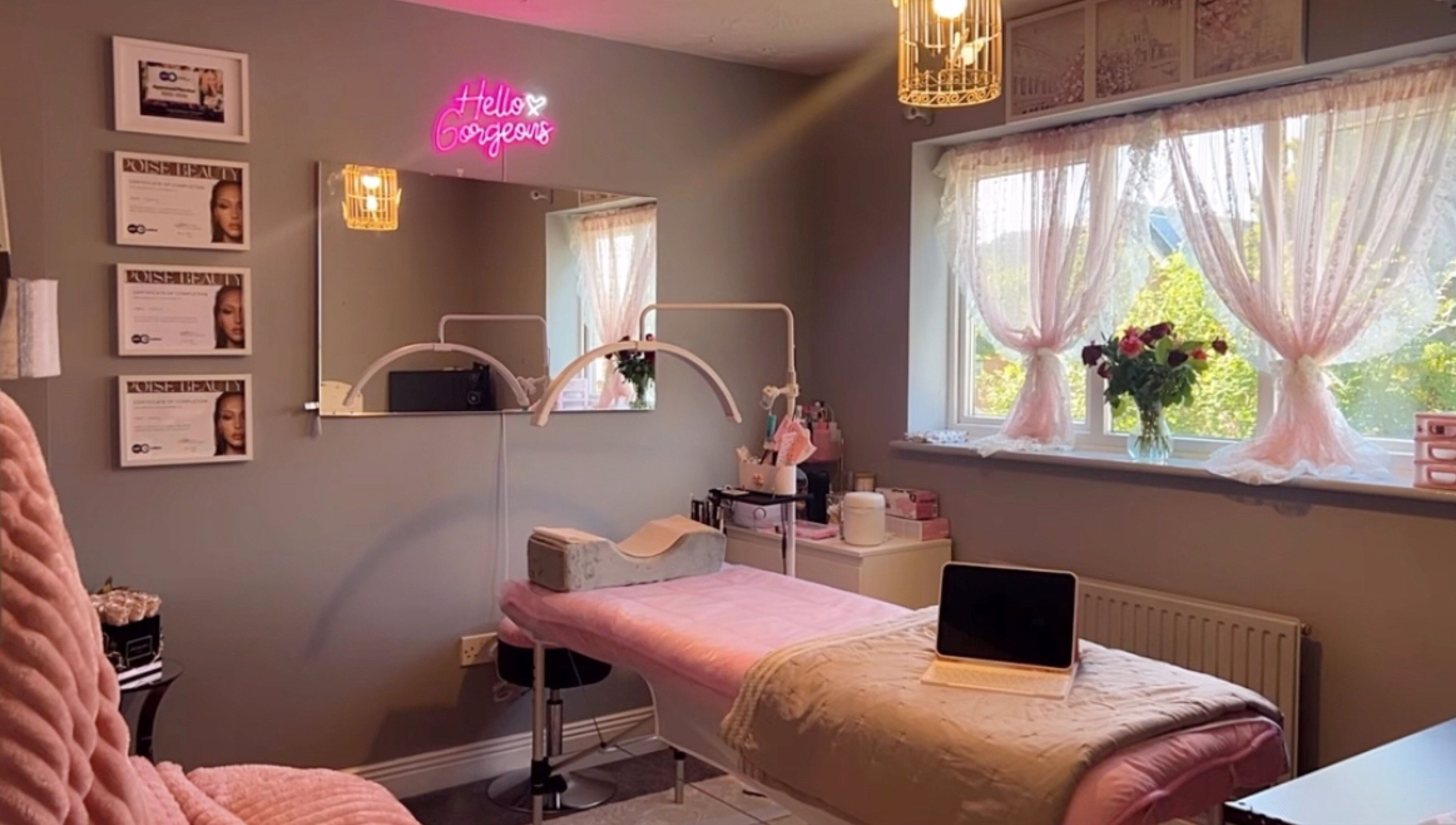 Elegant treatment room at Faces Enhanced, Nottingham, England, GB with soft decor and ambient lighting.