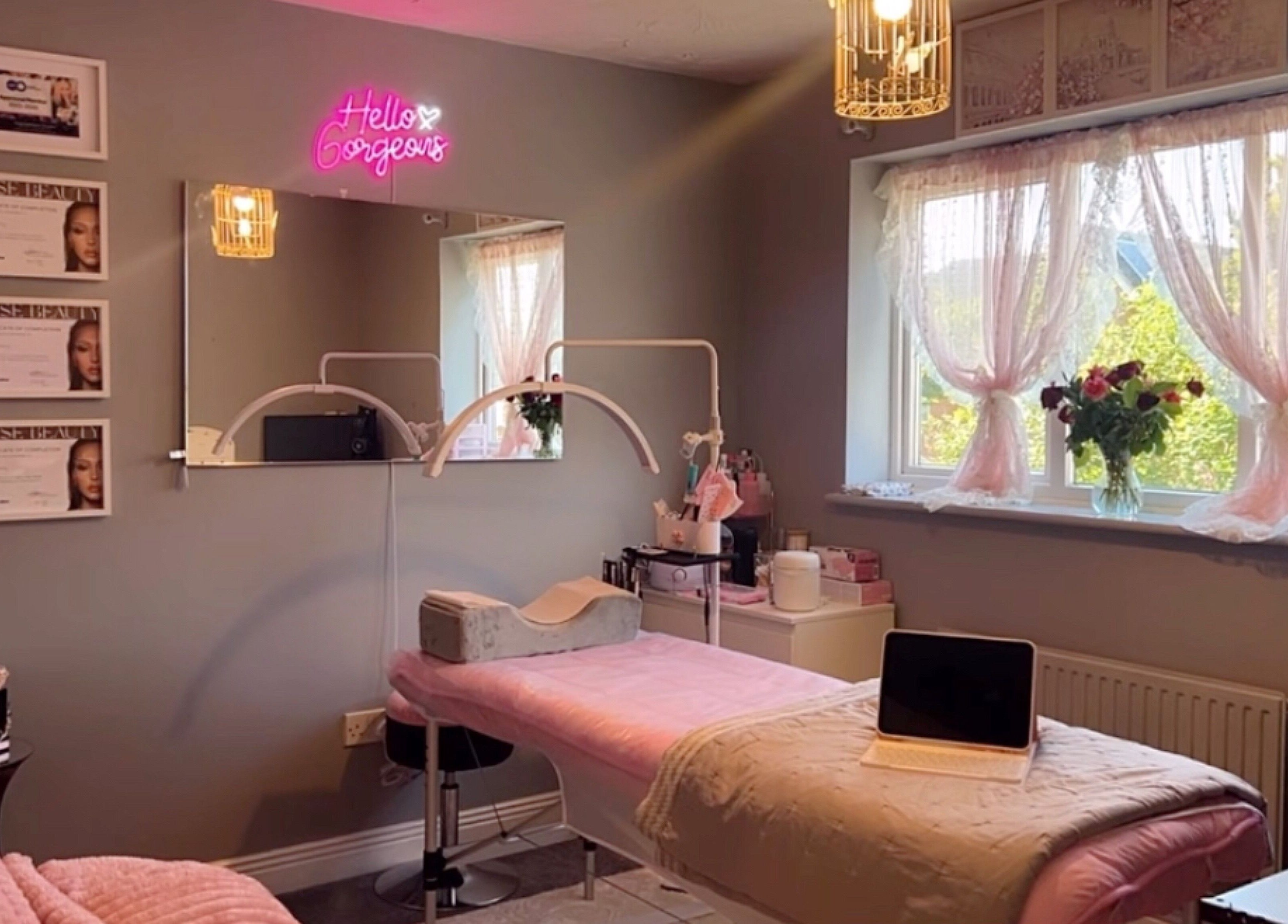 Elegant treatment room at Faces Enhanced, Nottingham, England, GB with soft decor and ambient lighting.