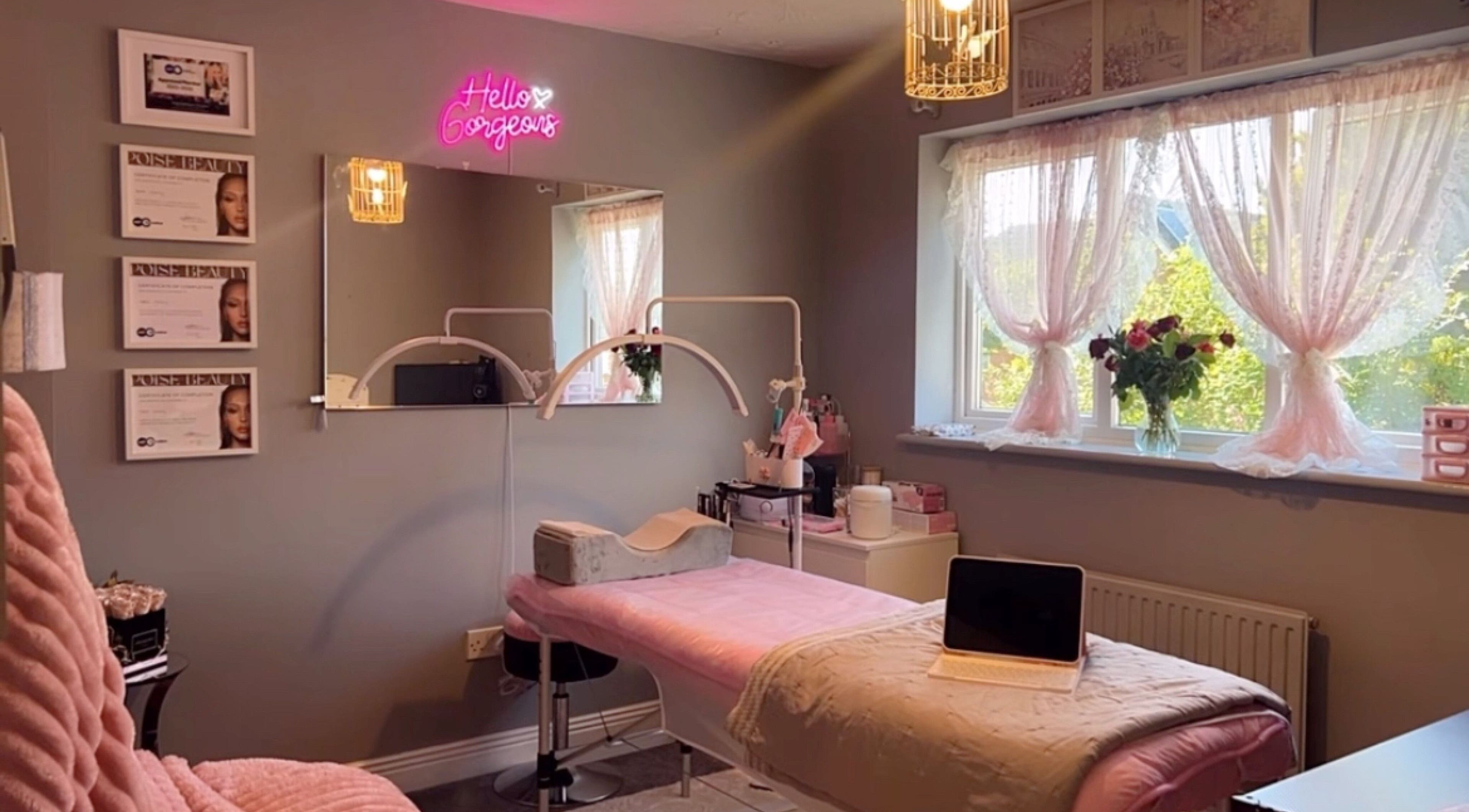 Elegant treatment room at Faces Enhanced, Nottingham, England, GB with soft decor and ambient lighting.