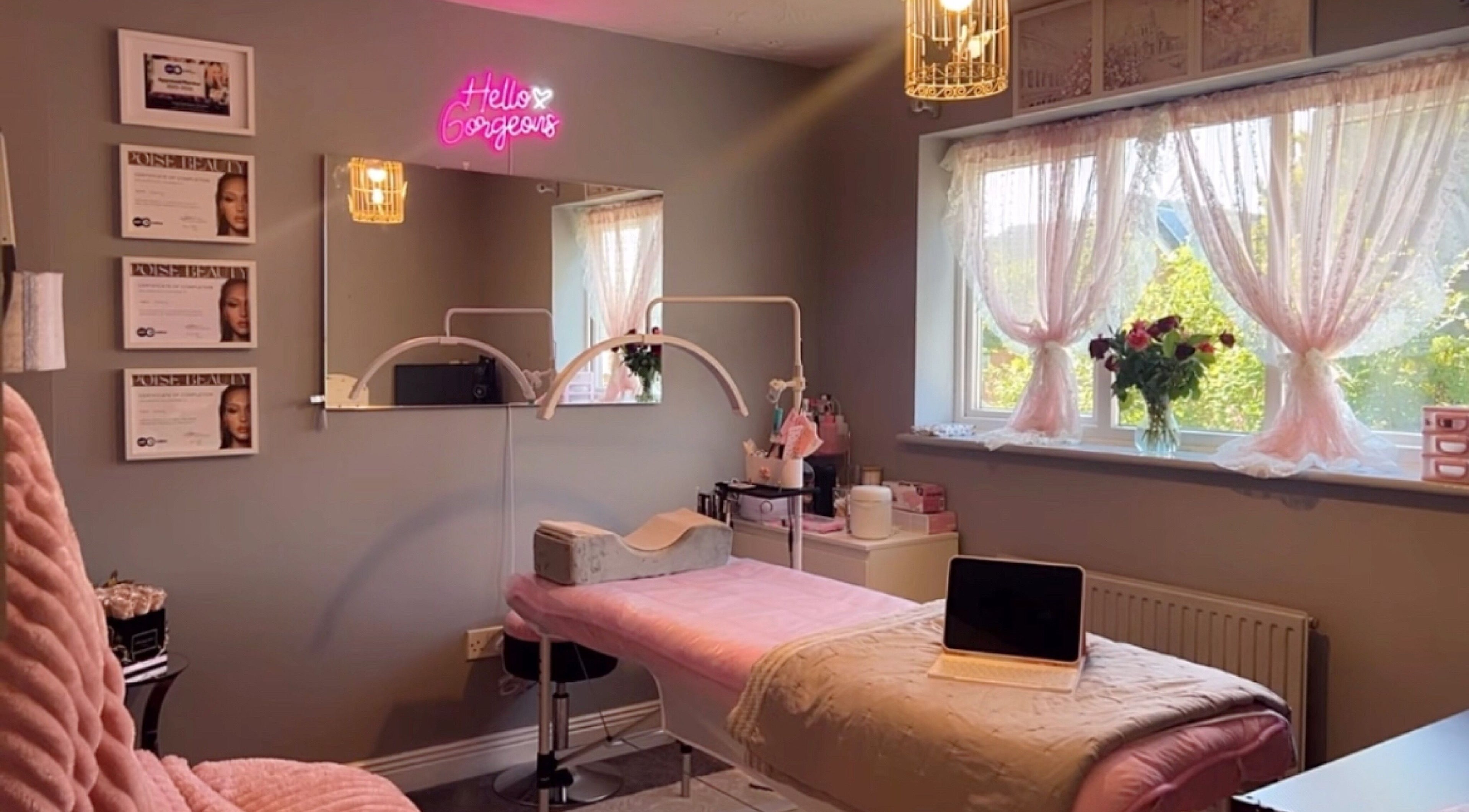 Elegant treatment room at Faces Enhanced, Nottingham, England, GB with soft decor and ambient lighting.