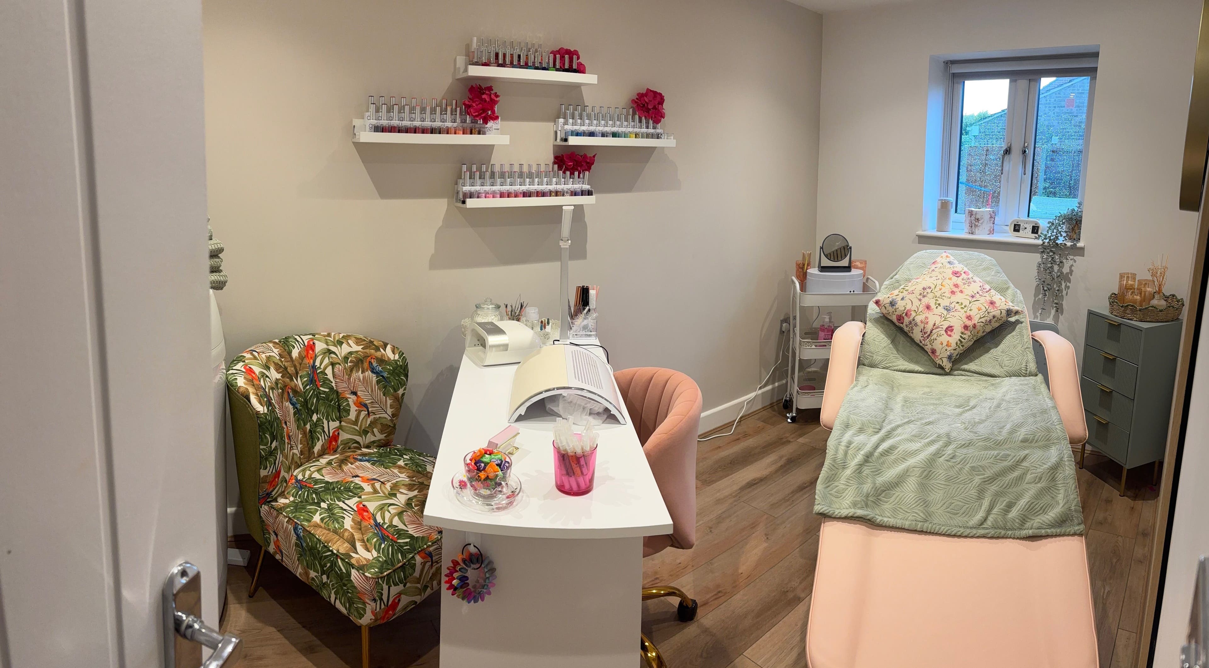 Cozy beauty room at Blooming Beautiful, Warsash, England, GB featuring treatment bed and colorful decor.