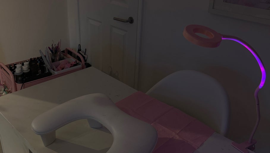 Nail station with pink lighting at Certified Lover Nails, Mitcham, England, GB. Ready for beauty treatments.