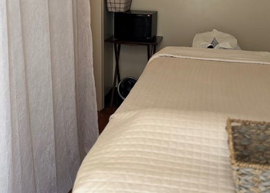 Tranquil treatment room at Relax Thai Spa, Redondo Beach, California, US, showcasing a cozy massage table.