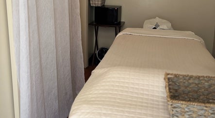 Tranquil treatment room at Relax Thai Spa, Redondo Beach, California, US, showcasing a cozy massage table.
