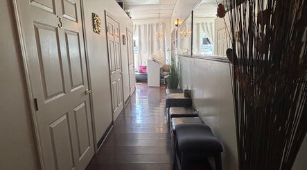 Serene hallway at Relax Thai Spa, Redondo Beach, California, featuring soothing decor and soft lighting.