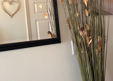 Stylish decor with dried plants and a heart-shaped wall art at Relax Thai Spa, Redondo Beach, California, US.