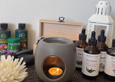 Essential oils and candle at Relax Thai Spa, Redondo Beach, California, US, for a serene wellness experience.