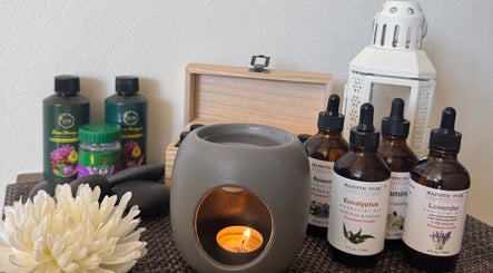 Essential oils and candle at Relax Thai Spa, Redondo Beach, California, US, for a serene wellness experience.