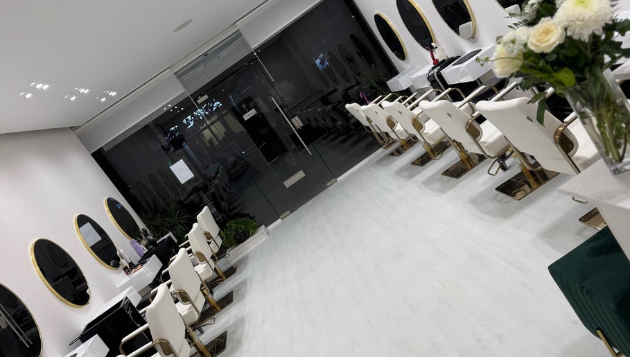 Chic interior of Cmf Hairdressing W6 in London Chiswick, England, GB, featuring stylish salon chairs and mirrors.