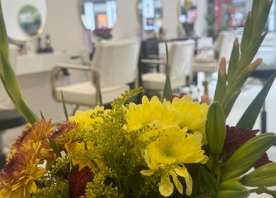 Vibrant floral arrangement at Cmf Hairdressing W6, London Chiswick, England, GB enhancing modern salon interior.