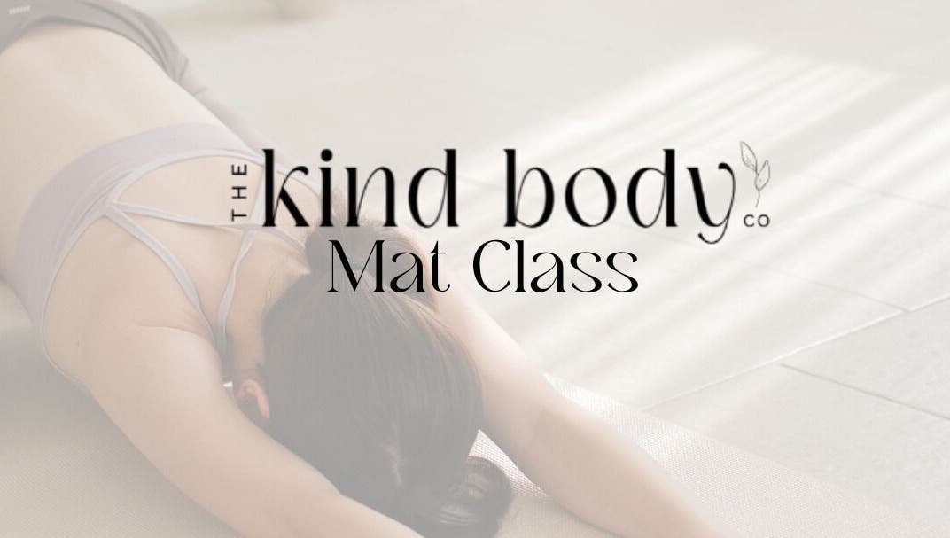 Woman in Pilates Mat Class at Sturgeon Bay, Wisconsin, US, stretching gracefully on mat.