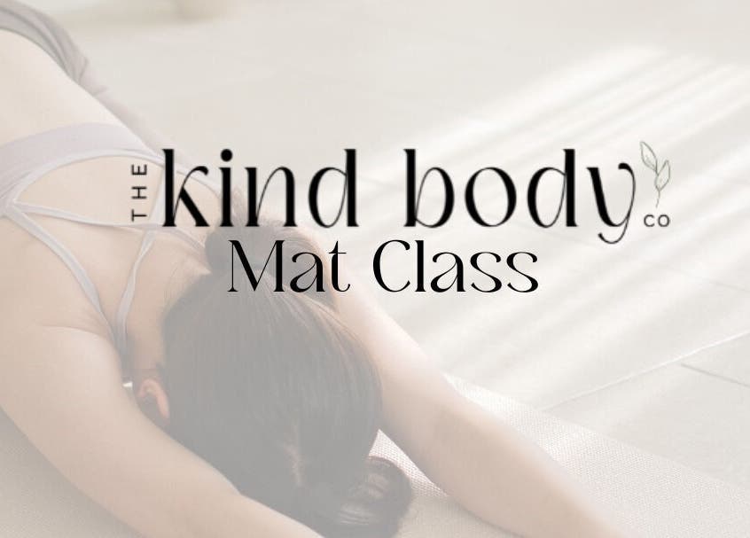 Woman in Pilates Mat Class at Sturgeon Bay, Wisconsin, US, stretching gracefully on mat.