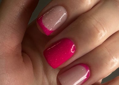 Vibrant pink nails at OF.LAMIMANI, Chicago, Illinois, US, showcasing exquisite nail art.